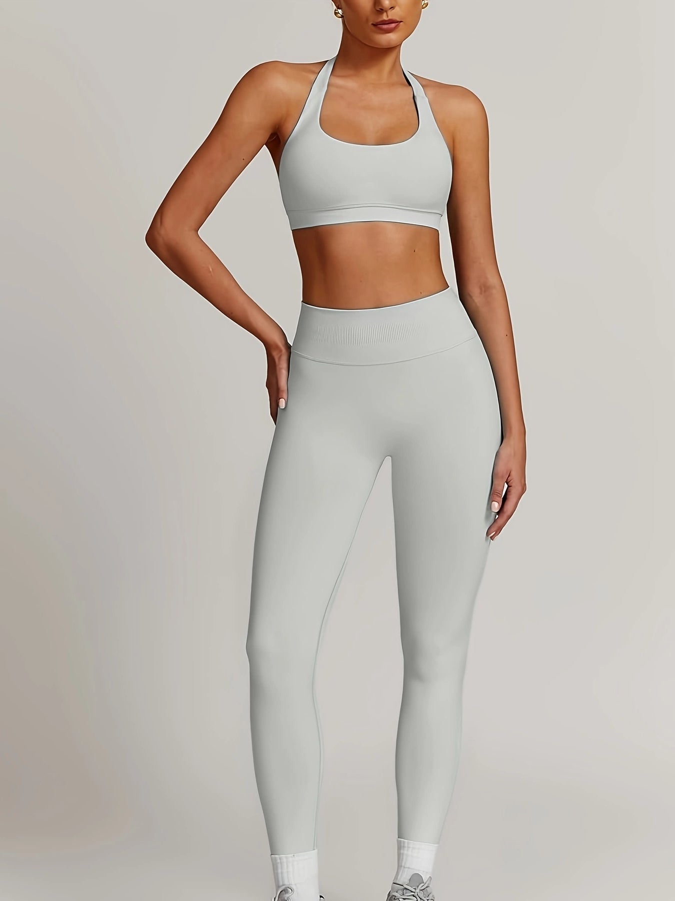 Women’s yoga set with supportive sports bra and high-waist leggings that sculpt and stay put.