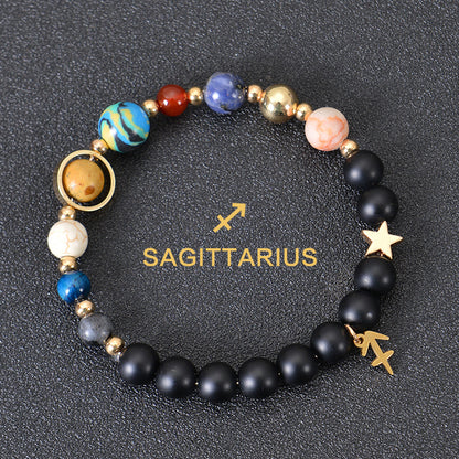 Carry the energy of the cosmos wherever you go. This Eight Planets Twelve Constellations Frosted Stone Beaded Bracelet blends.