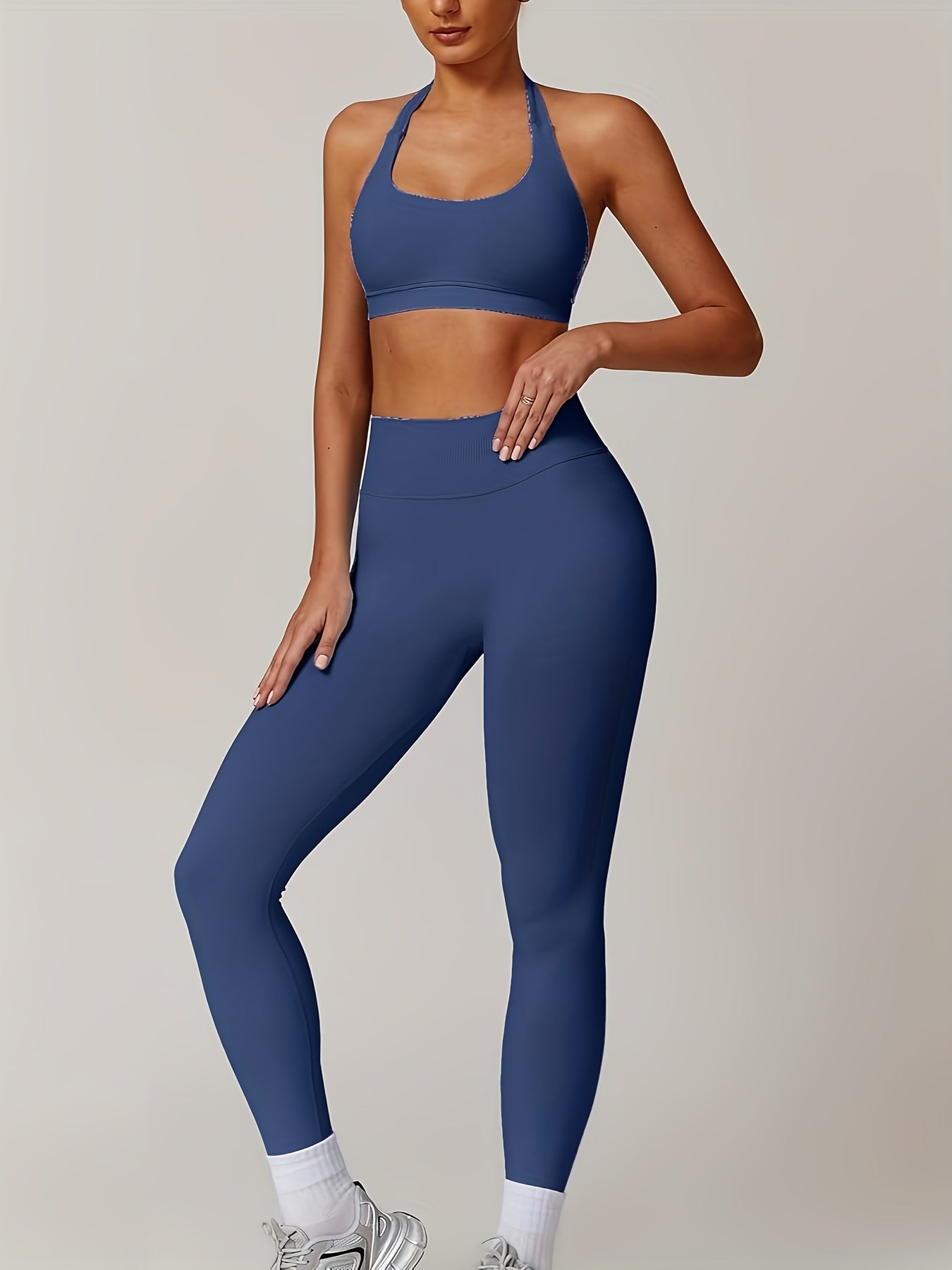 Women’s yoga set with supportive sports bra and high-waist leggings that sculpt and stay put.