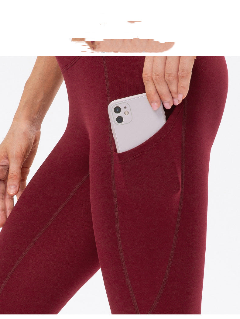 Warm high-waist running pants with moisture-wicking fabric, supportive fit, and pockets.
