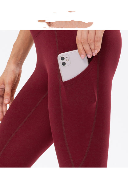 Warm high-waist running pants with moisture-wicking fabric, supportive fit, and pockets.