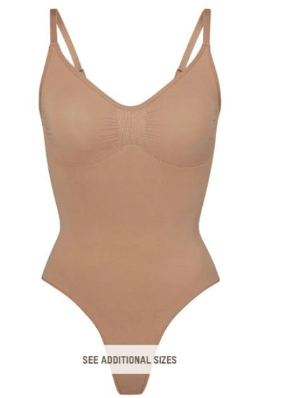 Shapewear with integrated hip support to sculpt curves and smooth the waist.