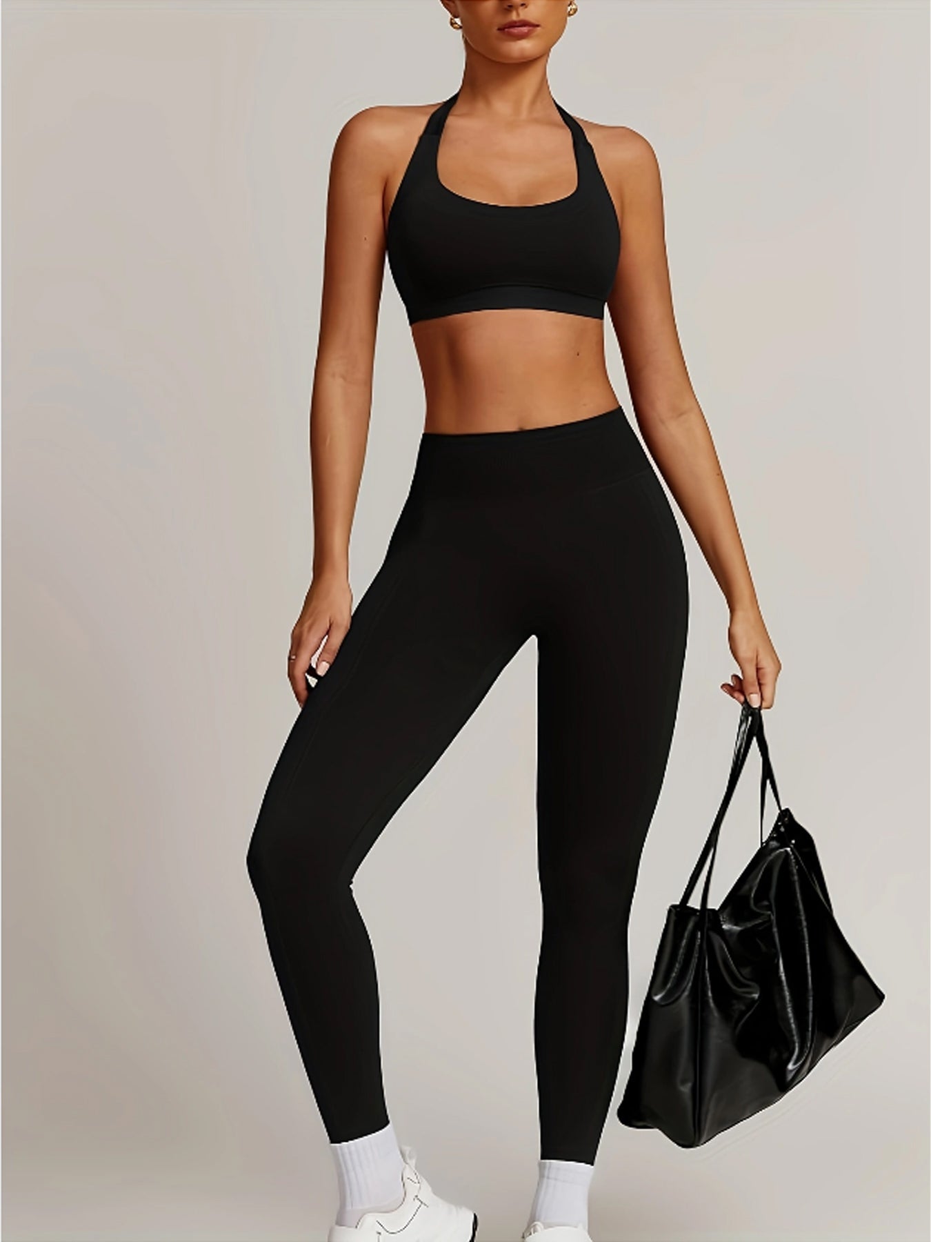Women’s yoga set with supportive sports bra and high-waist leggings that sculpt and stay put.
