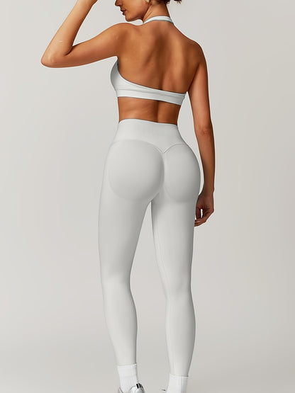 Women’s yoga set with supportive sports bra and high-waist leggings that sculpt and stay put.