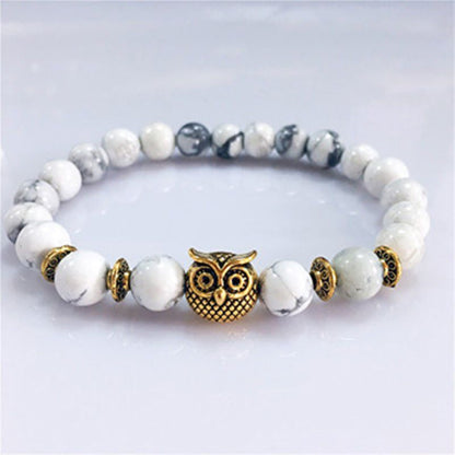 This Owl Tiger’s Eye Volcanic Stone Energy Bracelet combines powerful protection stones with an owl charm representing wisdom and intuition.