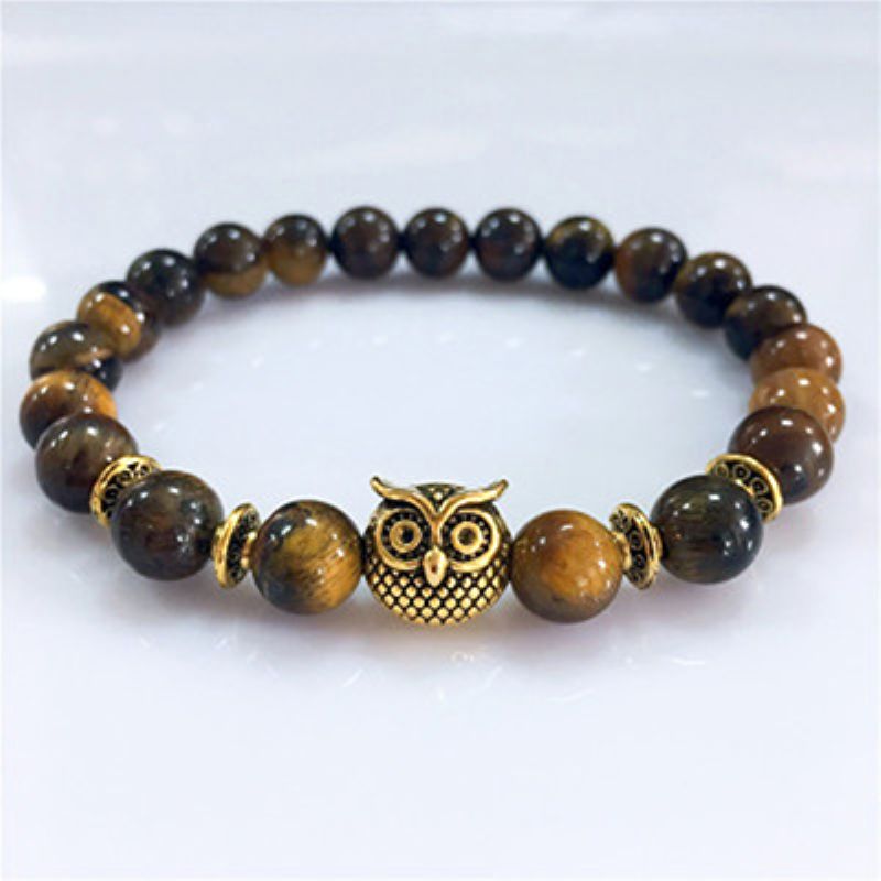 This Owl Tiger’s Eye Volcanic Stone Energy Bracelet combines powerful protection stones with an owl charm representing wisdom and intuition.