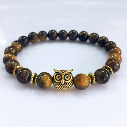 This Owl Tiger’s Eye Volcanic Stone Energy Bracelet combines powerful protection stones with an owl charm representing wisdom and intuition.