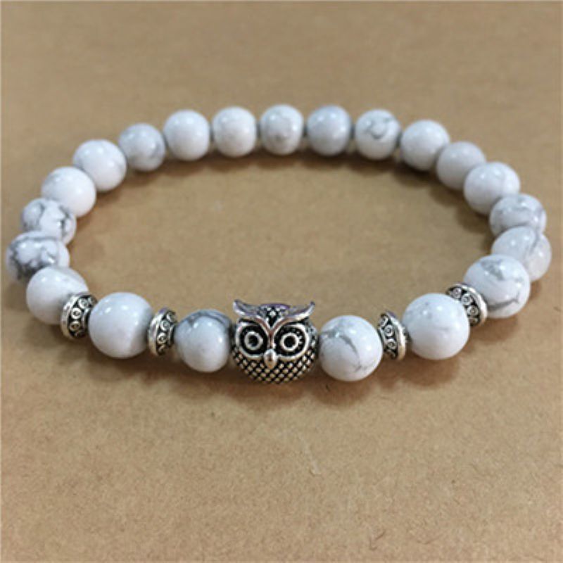 This Owl Tiger’s Eye Volcanic Stone Energy Bracelet combines powerful protection stones with an owl charm representing wisdom and intuition.