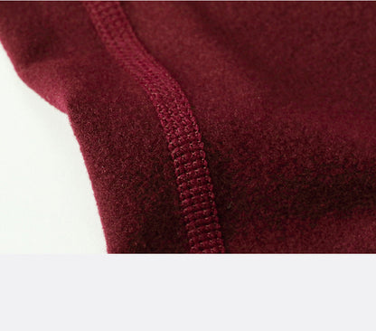 Warm high-waist running pants with moisture-wicking fabric, supportive fit, and pockets.