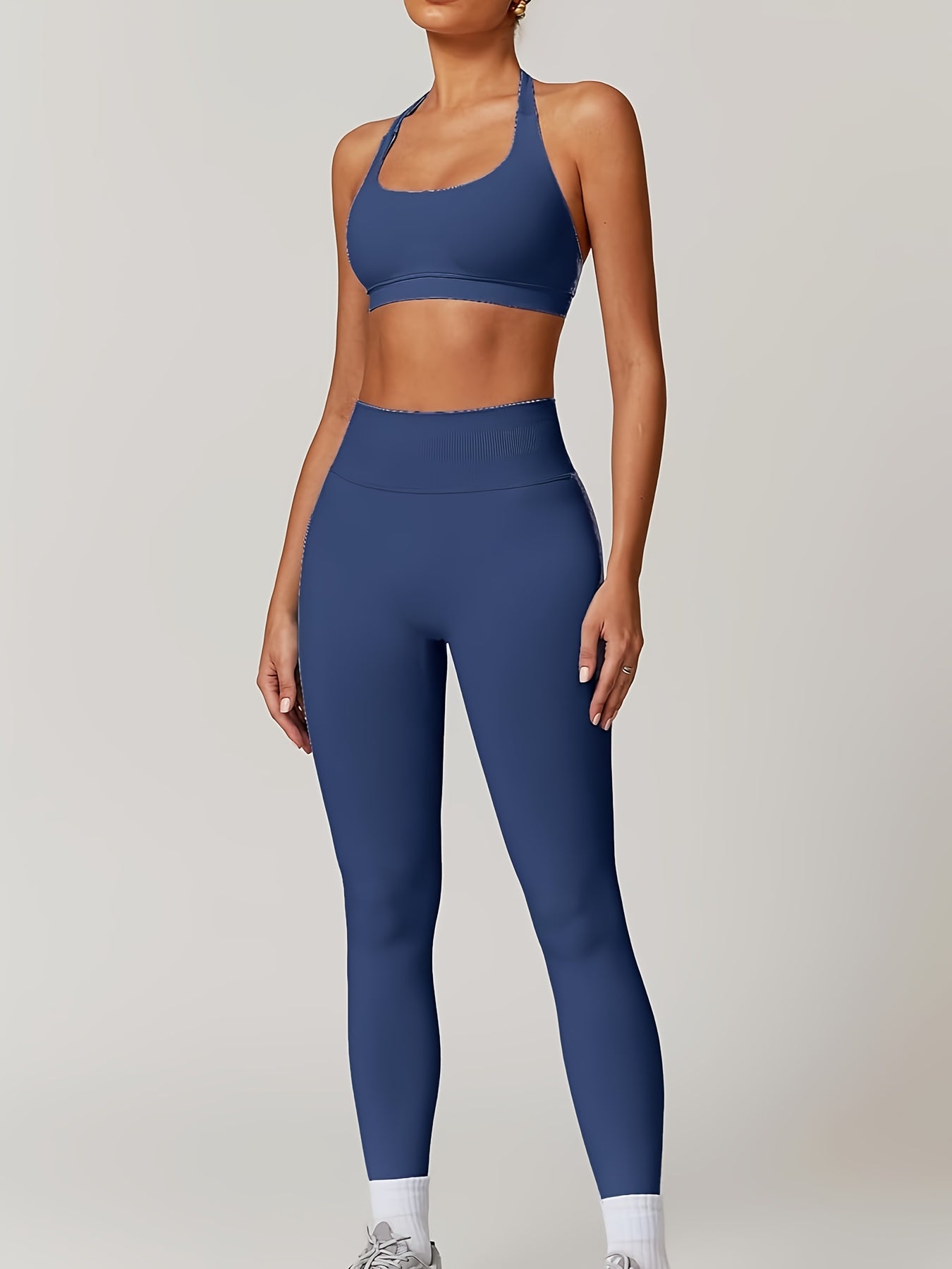 Women’s yoga set with supportive sports bra and high-waist leggings that sculpt and stay put.