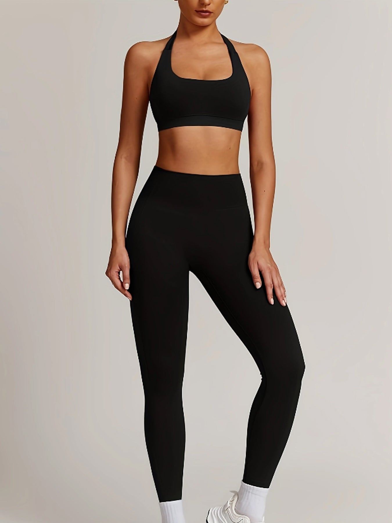 Women’s yoga set with supportive sports bra and high-waist leggings that sculpt and stay put.