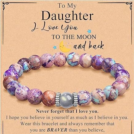 This Natural Purple Emperor Stone Match Moonstone Elastic Beaded Bracelet blends soothing crystal energy with timeless style for everyday wear