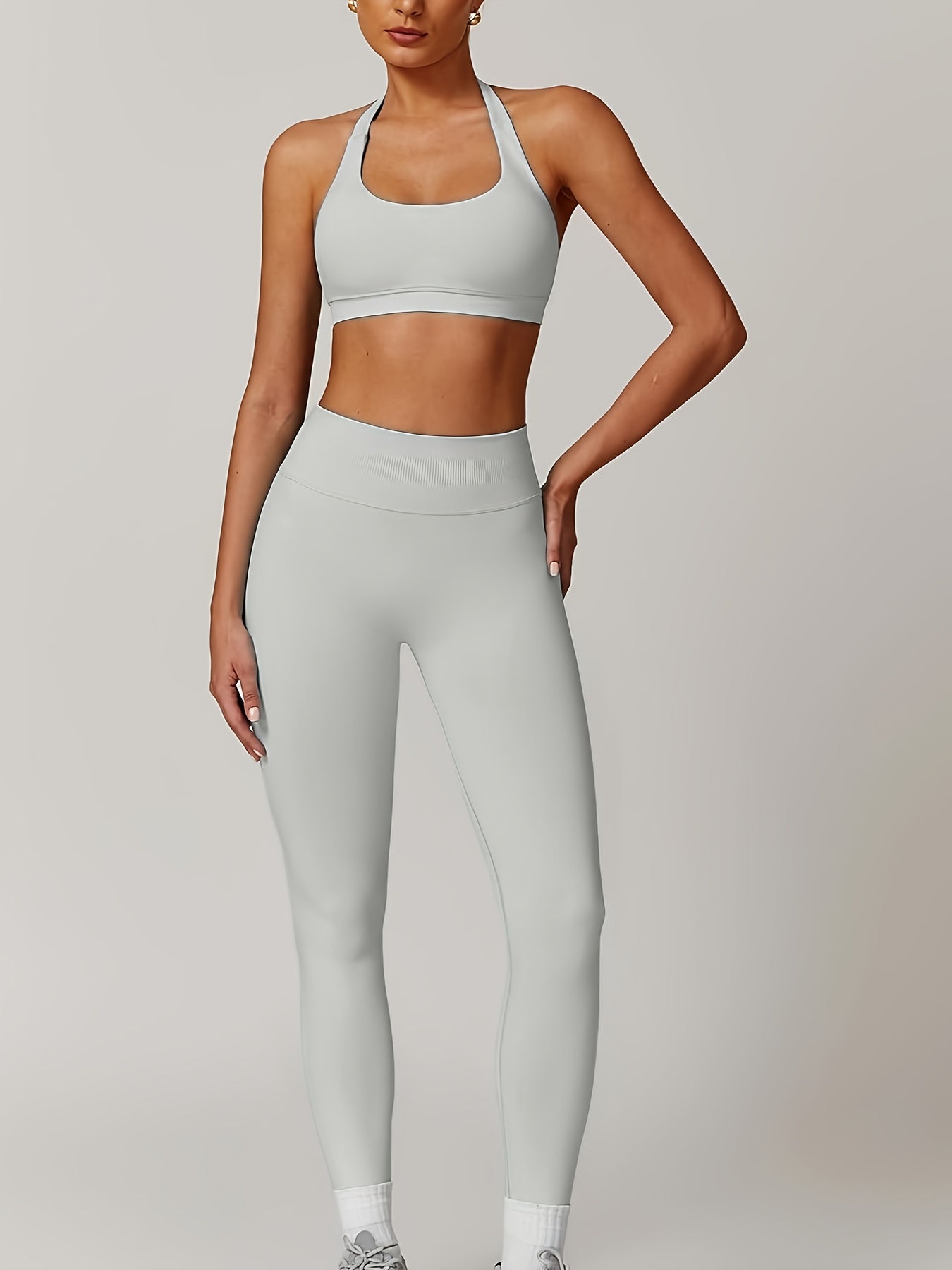 Women’s yoga set with supportive sports bra and high-waist leggings that sculpt and stay put.