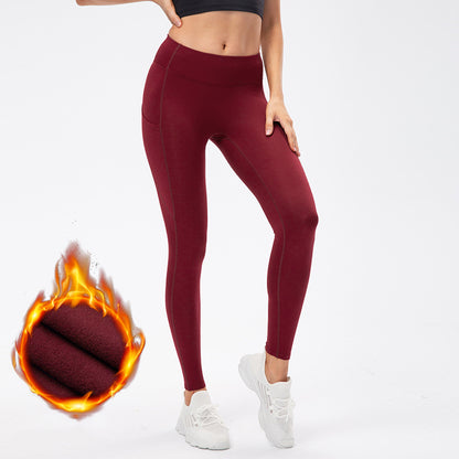Warm high-waist running pants with moisture-wicking fabric, supportive fit, and pockets.